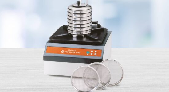 LAVIB analytical screening machine for classifying fibrous and flat bulk materials - machine on a table, screening tower with 7 screens, three screens in front of it