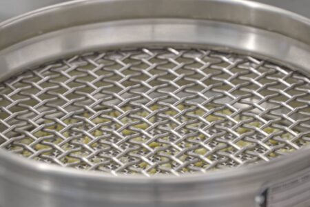 Analytical screening machines View of the screening tower and zirconium oxide beads