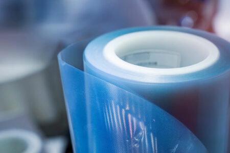 Semi-transparent polyethylene film rolled up