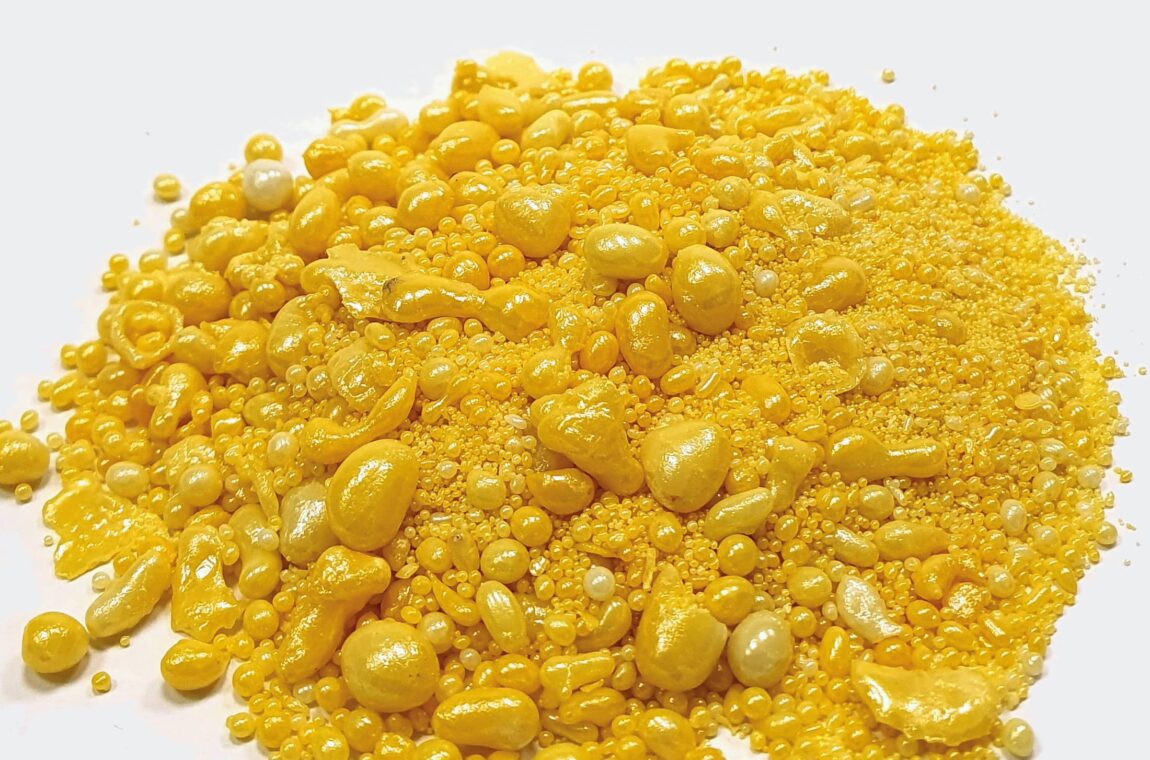 Zirconium oxide or zirconium dioxide, a shiny yellow granulate